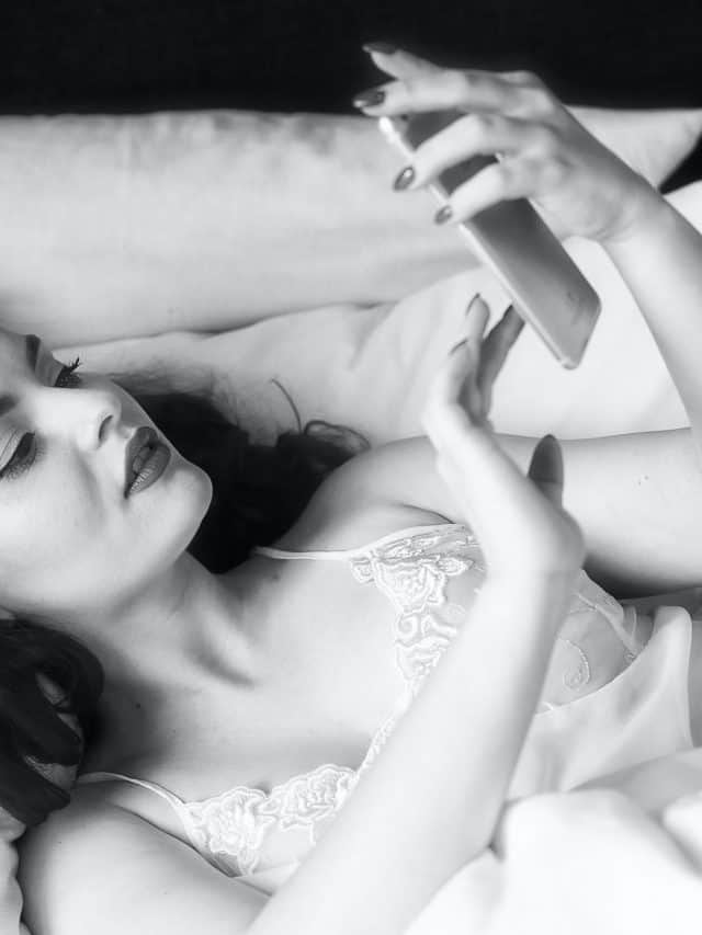 woman in morning holding a phone to text