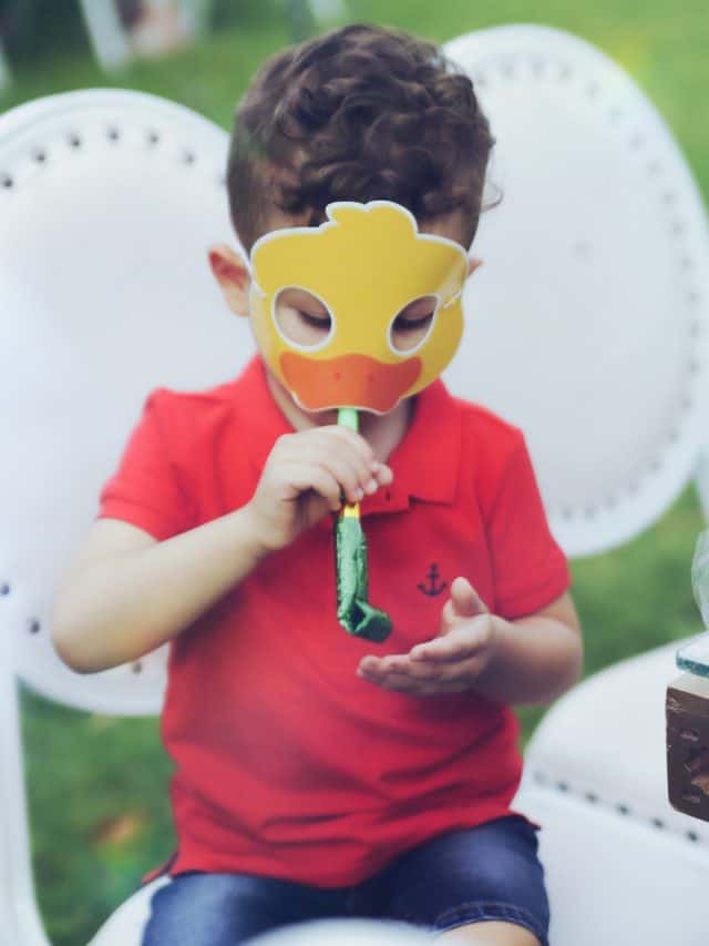 little one on a birthday having fun