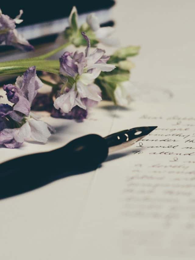 pen and flowers on a letter written to show love