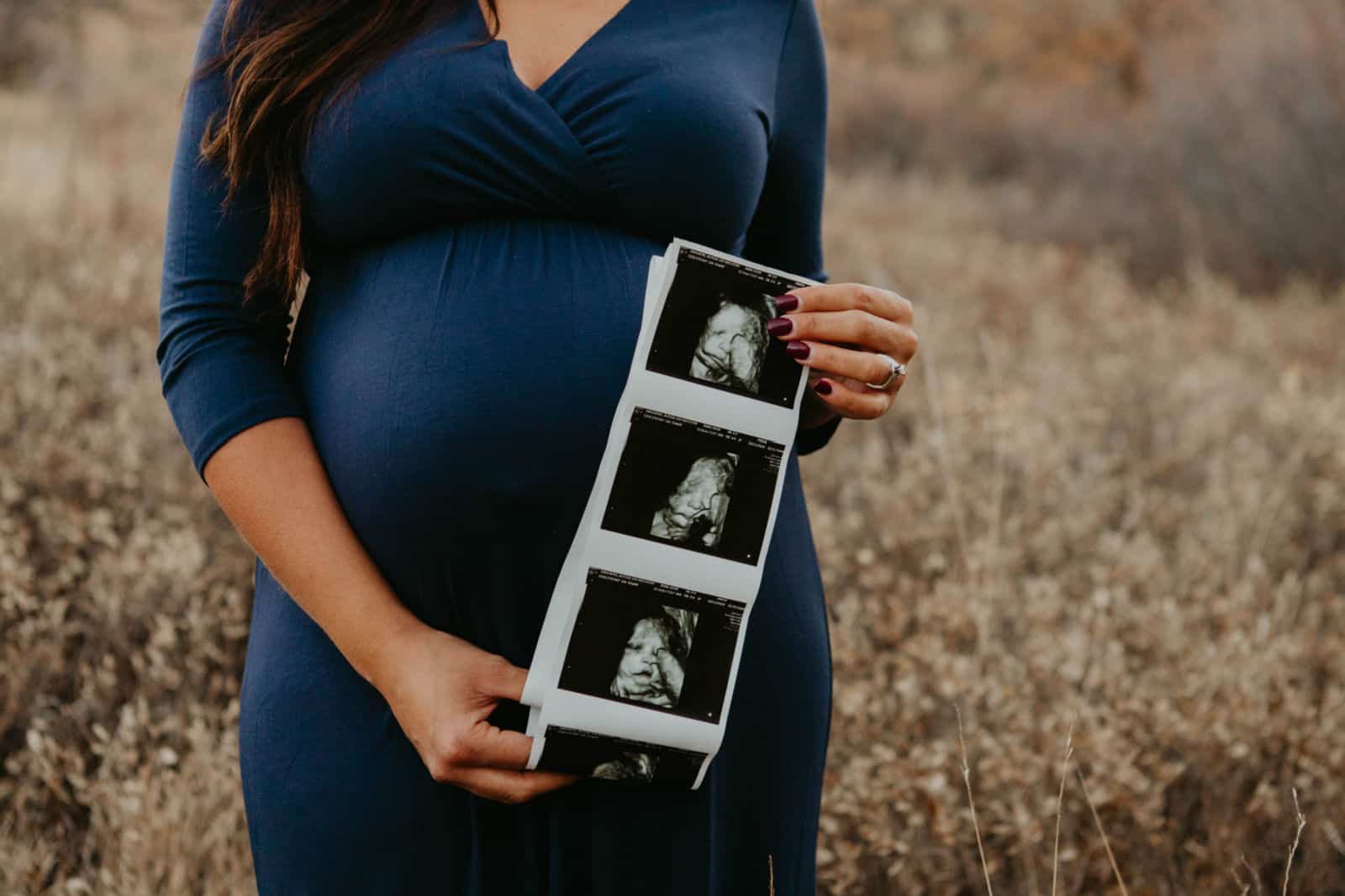 pregnancy announcement with ultrasound in a field