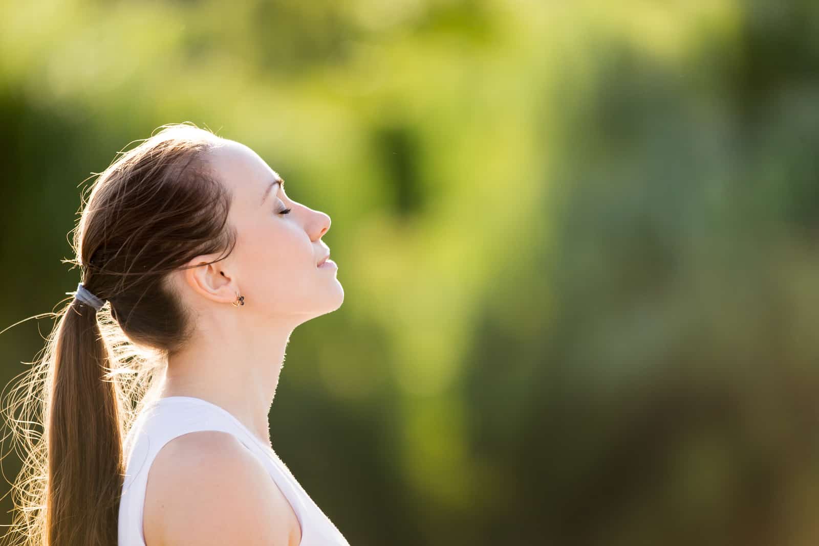 calm woman breathing in the air