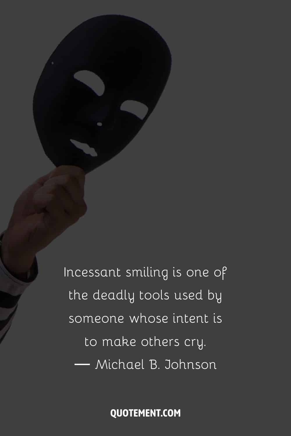 black mask in a hand image representing a deep fake quote
