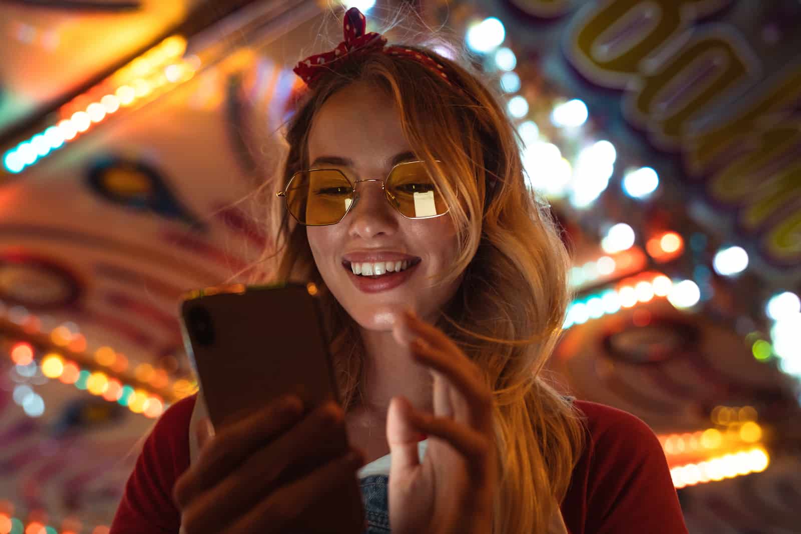 woman with sunglasses using phone