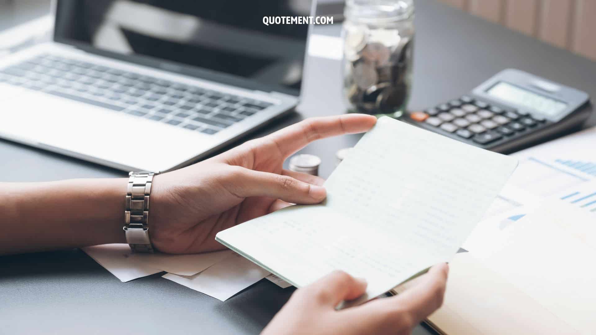 person working on laptop and looking at paperwork, concept of accountability quotes