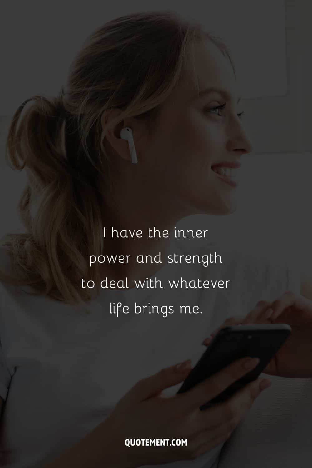 a happy woman holding her phone representing example of affirmation quote