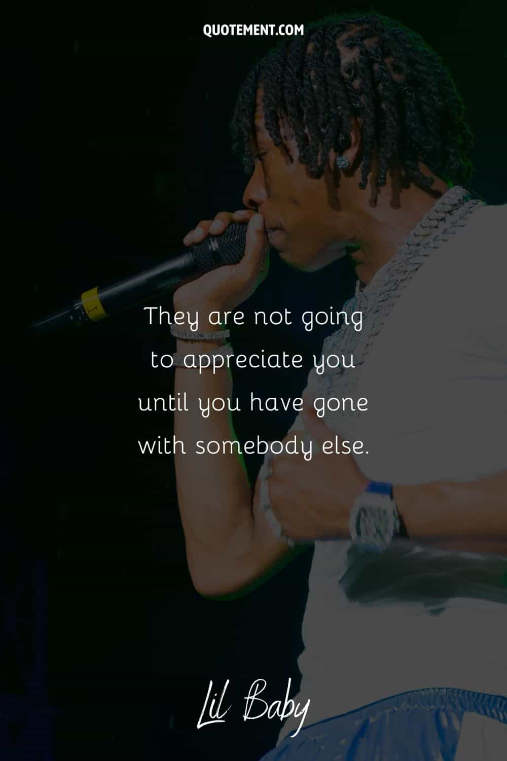 rapper with icy watch image representing lil baby loyalty quote