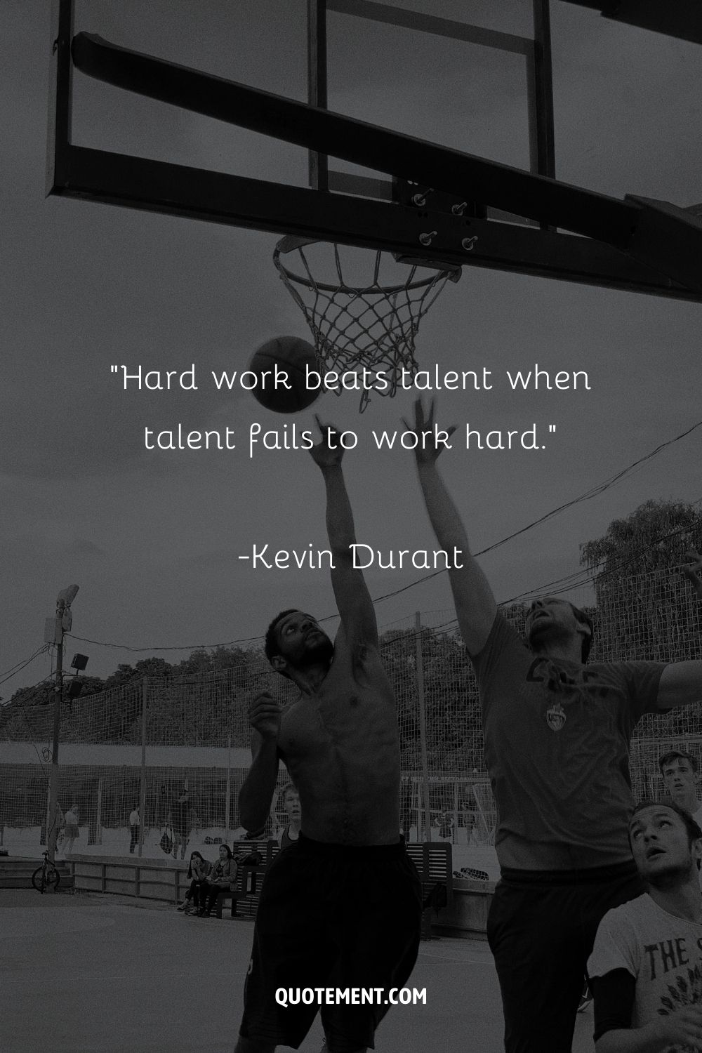 Image of an outdoor court with a short hard work quote.

