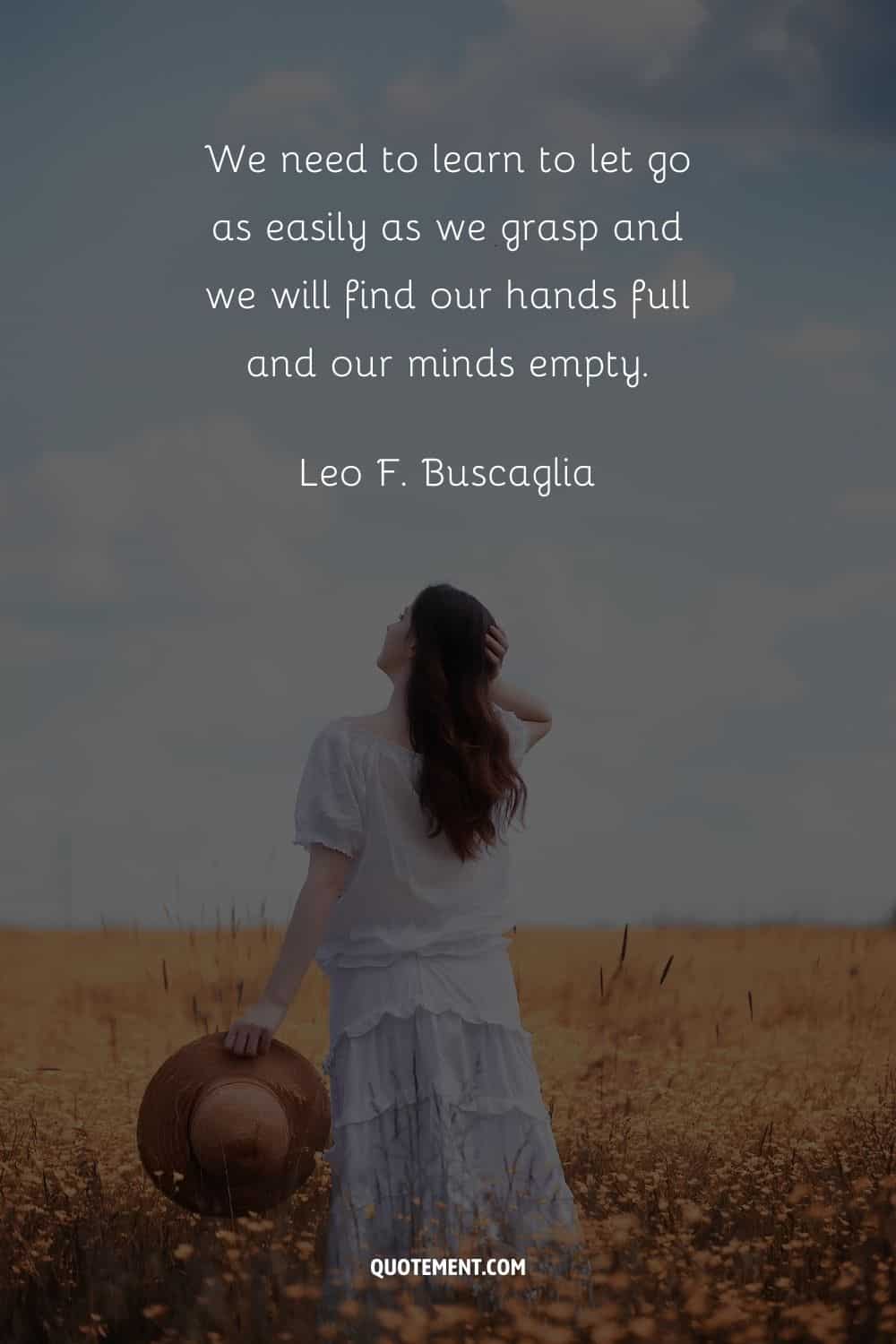 a woman in a field representing letting go quote