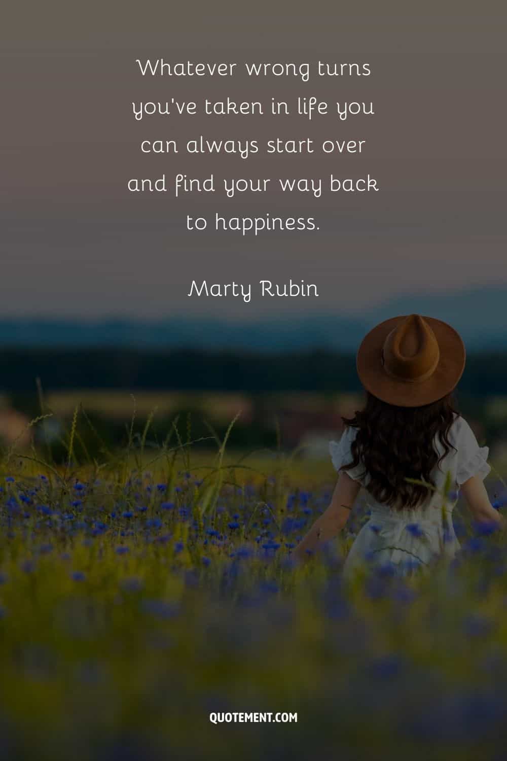 a woman in a flower field representing an inspirational quote for starting over