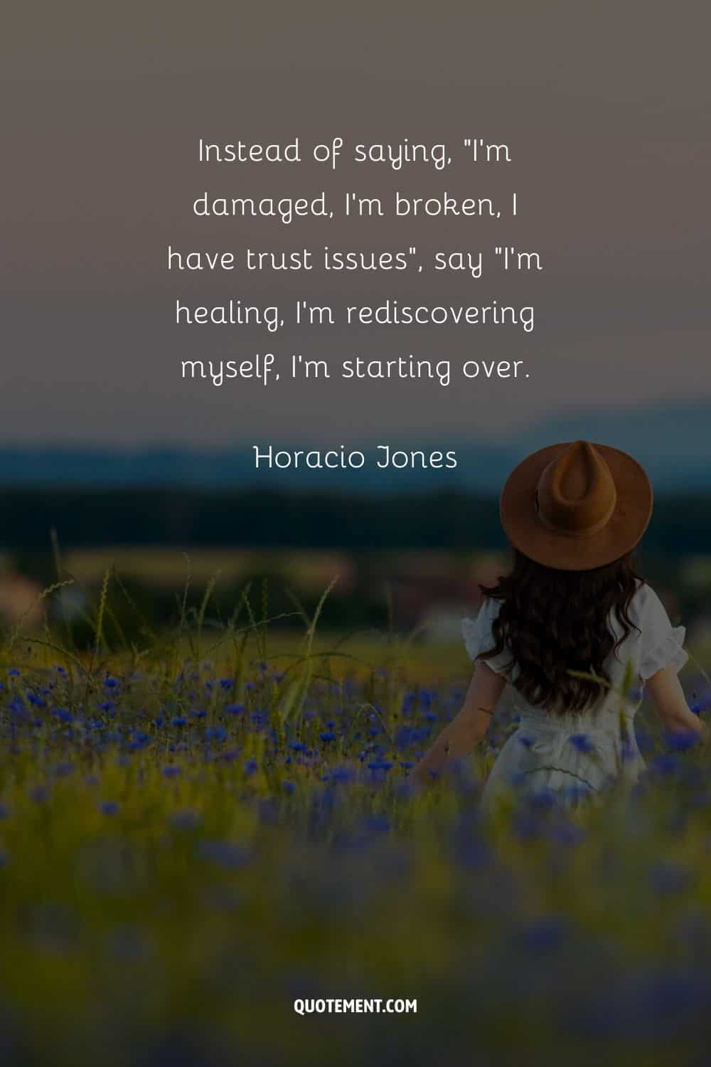 a woman walking in a flower field representing an inspiring quote on starting again