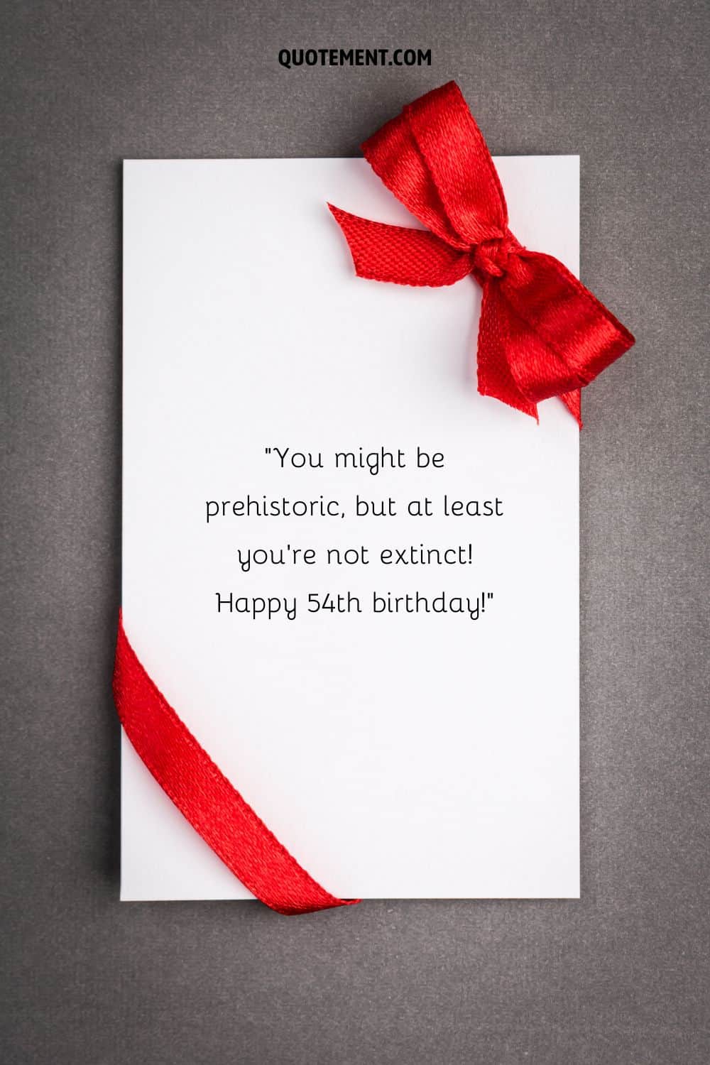 Funny message for their 54th birthday on a white birthday card with a red ribbon
