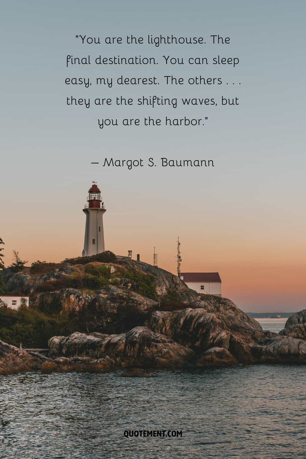 Inspiring quote by Margot S. Baumann and a lighthouse in the background
