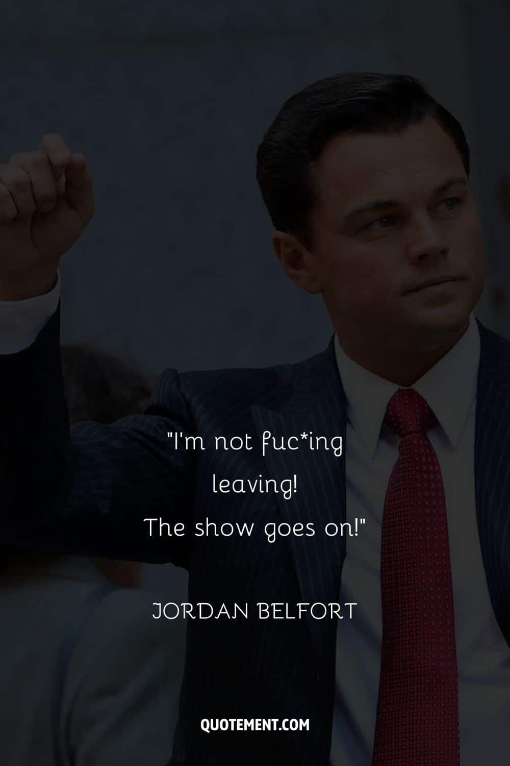 Leonardo DiCaprio wearing a red tie representing Jordan Belfort motivational quote

