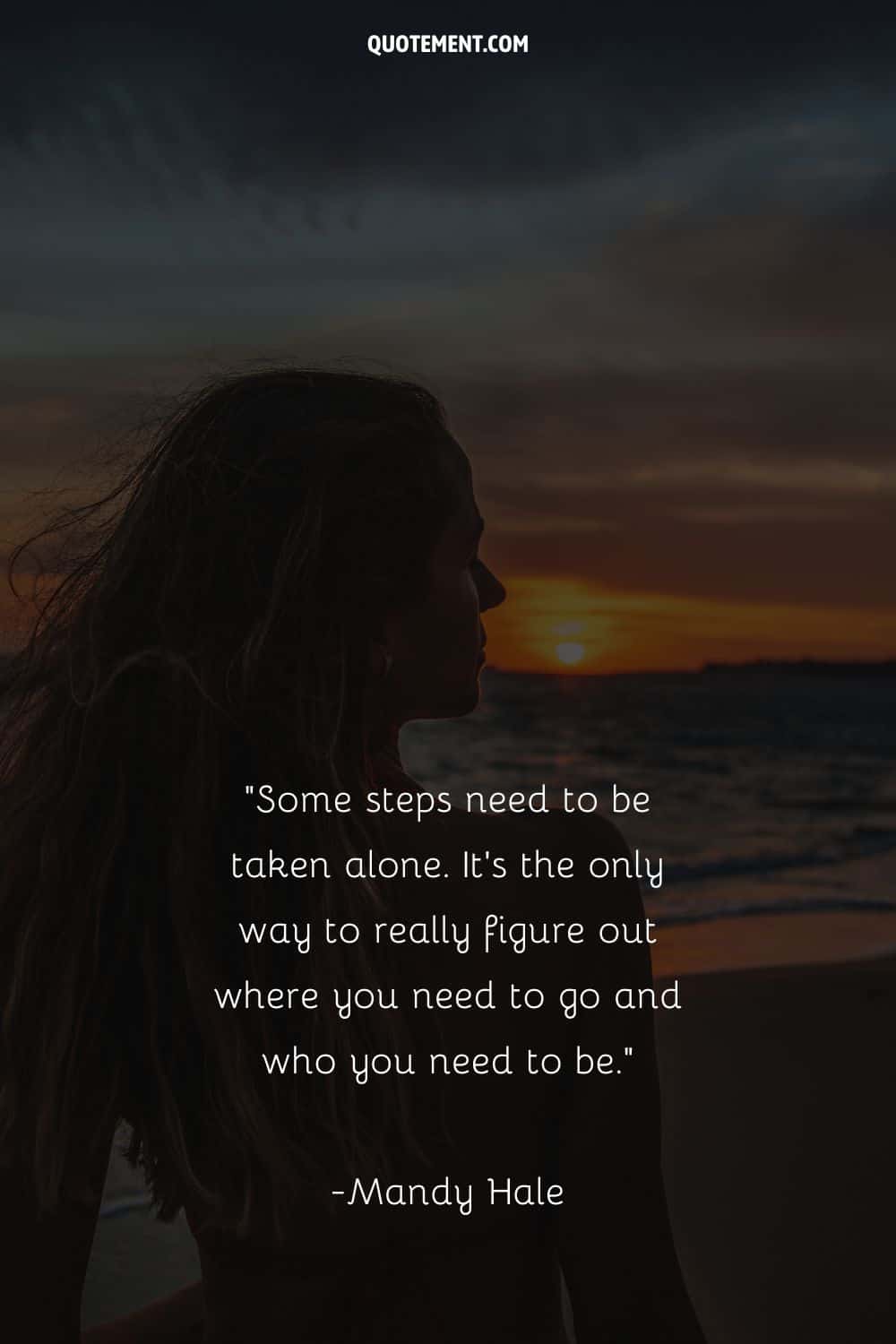a girl at the beach during sunset representing taking steps alone quote
