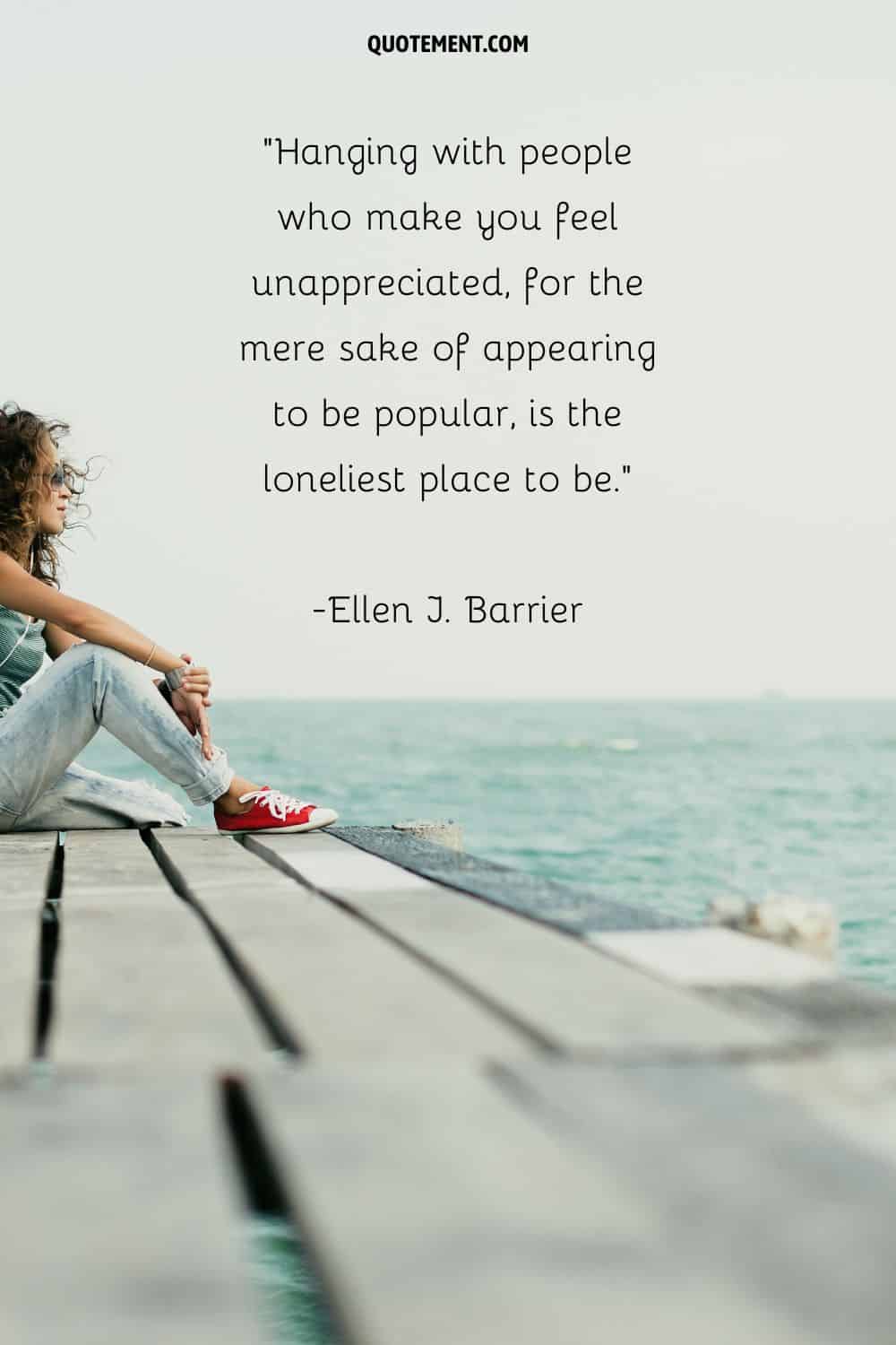 a girl with sunglasses sitting at the beach representing encouraging quote on being lonely
