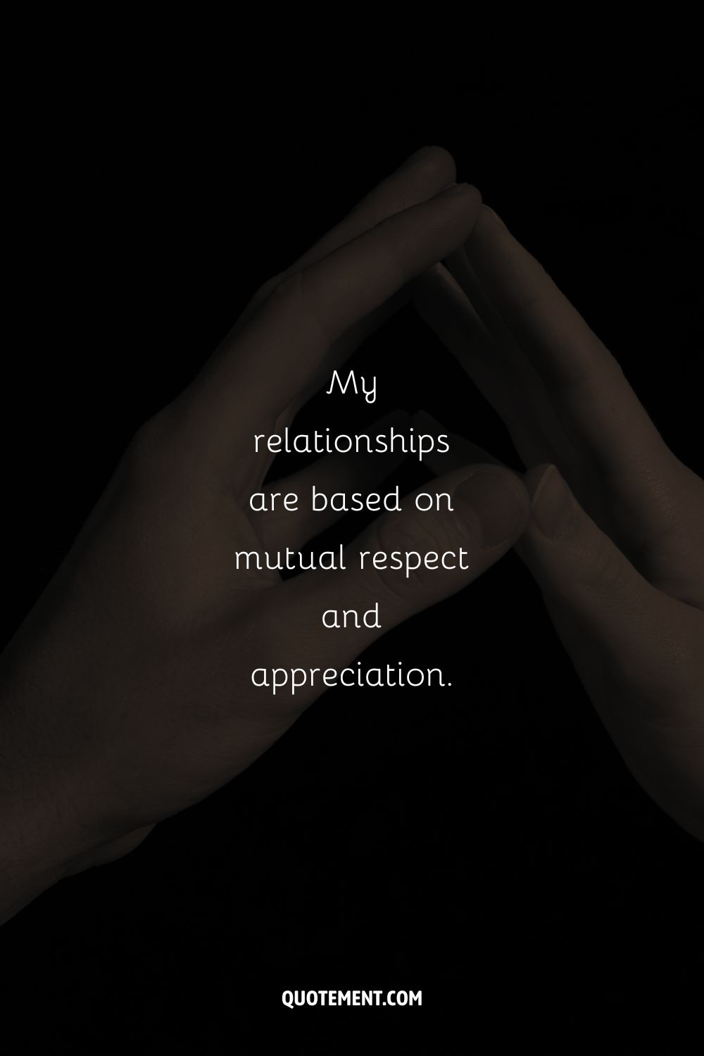 dark photograph of two hands representing an affirmation for relationships
