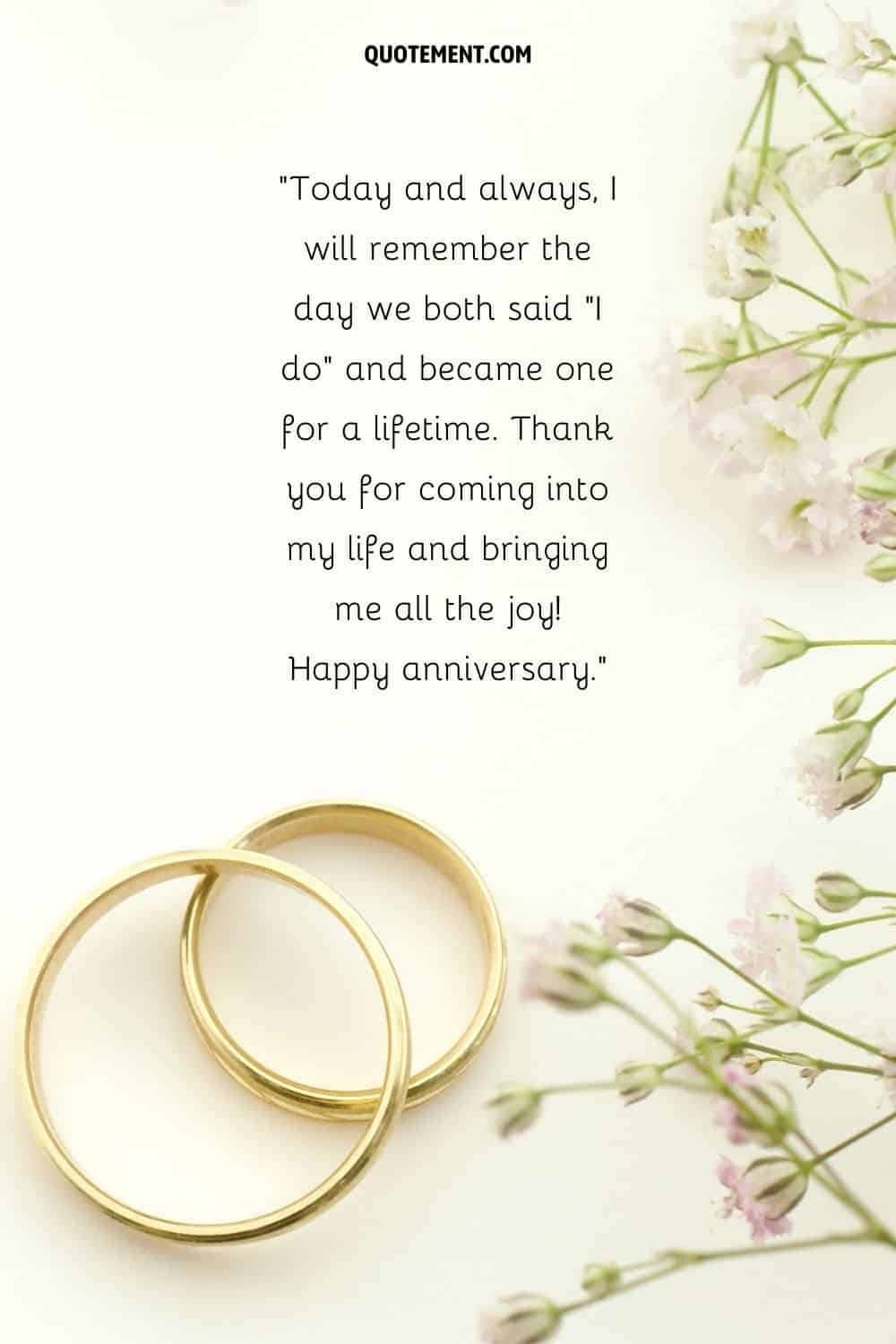 golden wedding rings and flowers representing anniversary quote for her