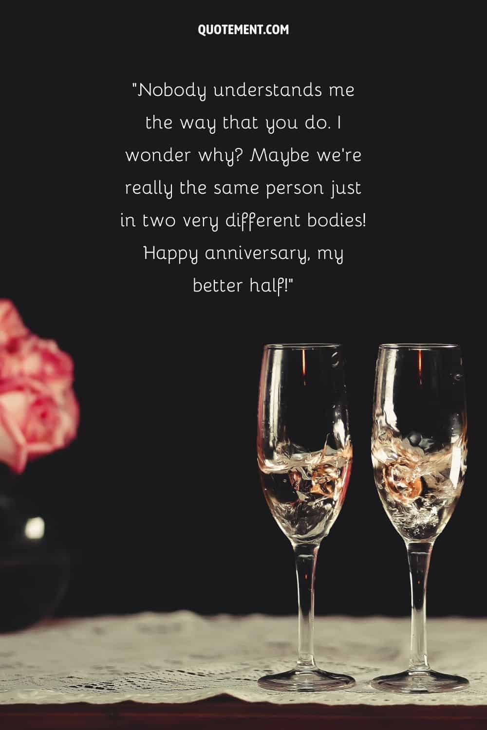 two champagne glasses with wedding rings representing the loveliest happy anniversary quote for wife