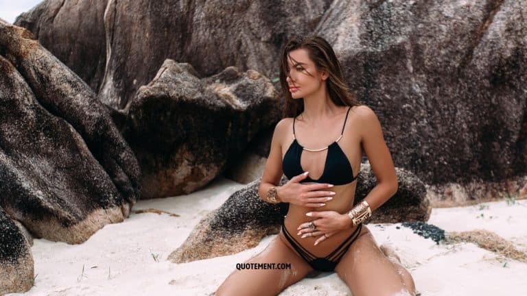 woman on a beach in a black bikini