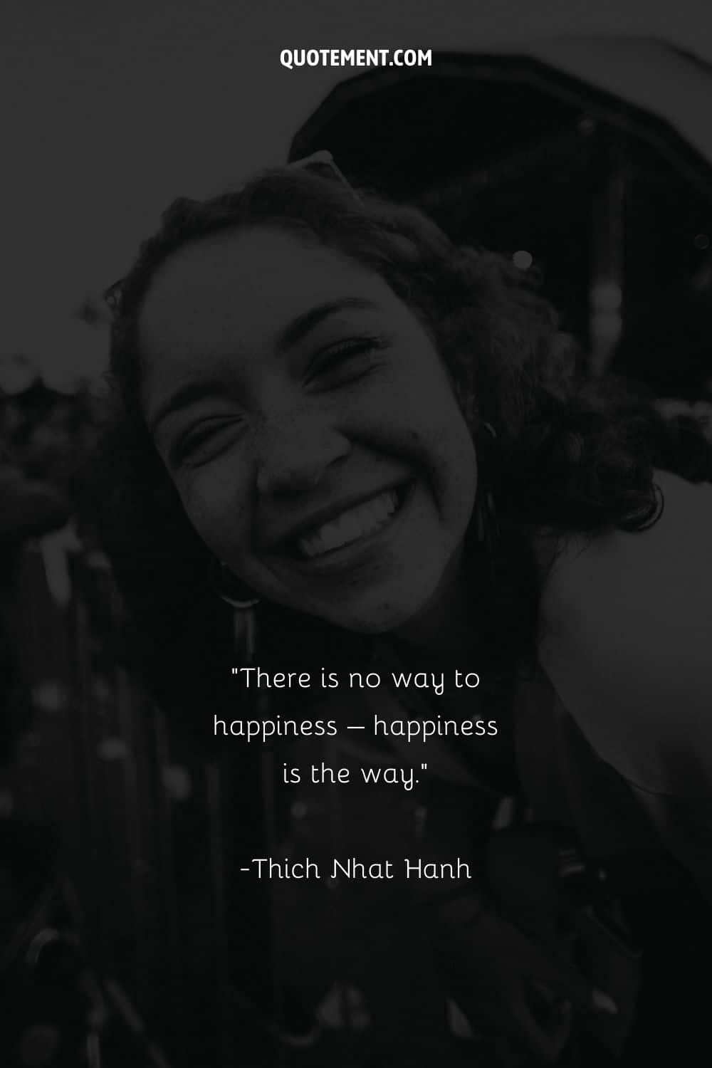 Image of a girl's genuine laughter represenitng a quote on happiness
