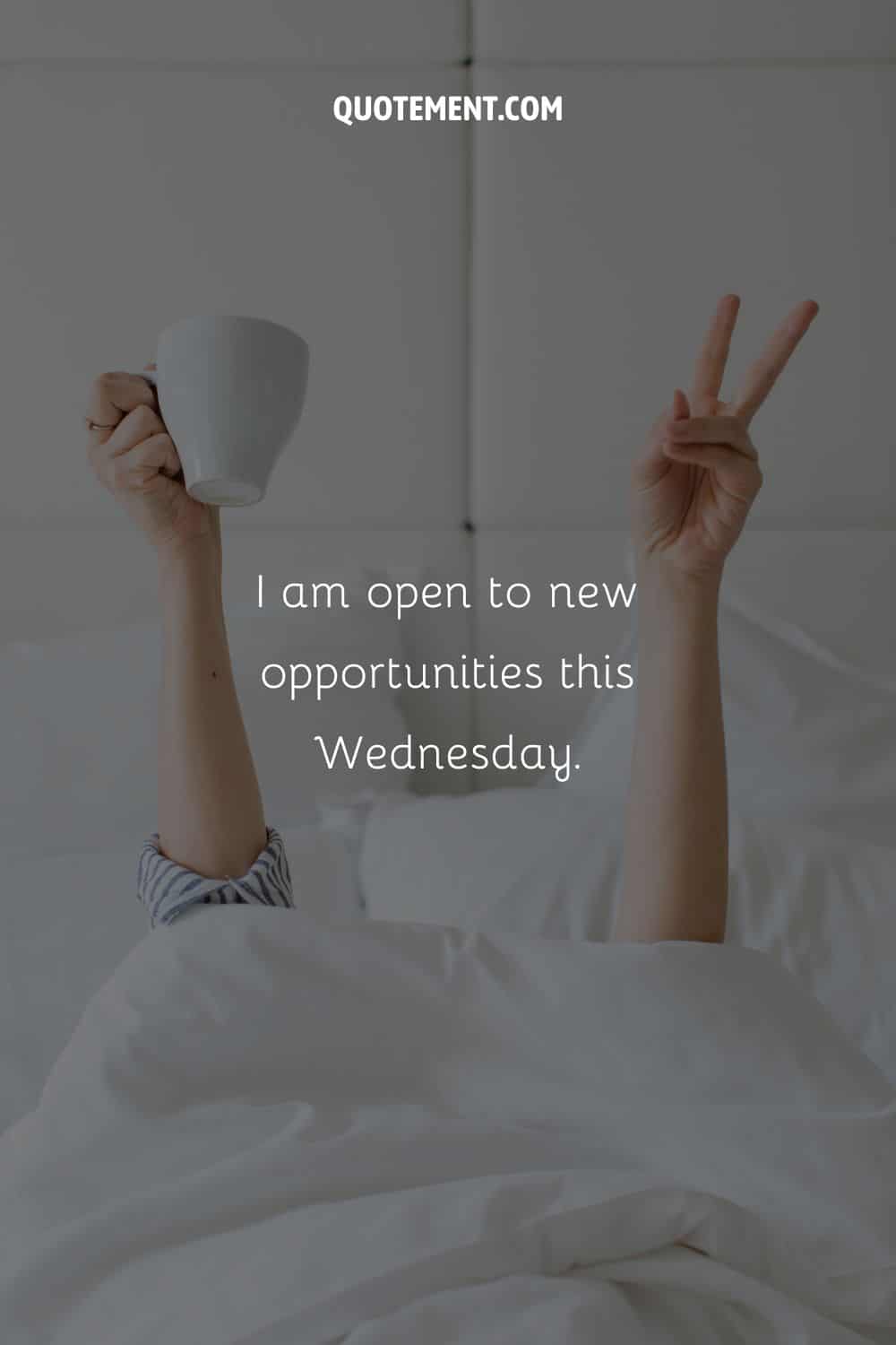 Image of a person in bed with their arms up representing an affirmation for Wednesday.