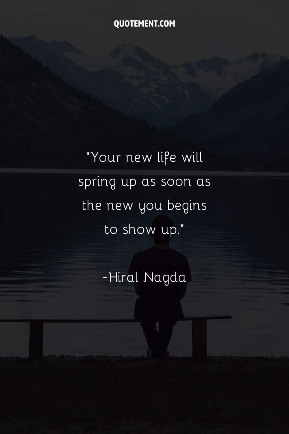 Image of a person seated by water representing a new life quote