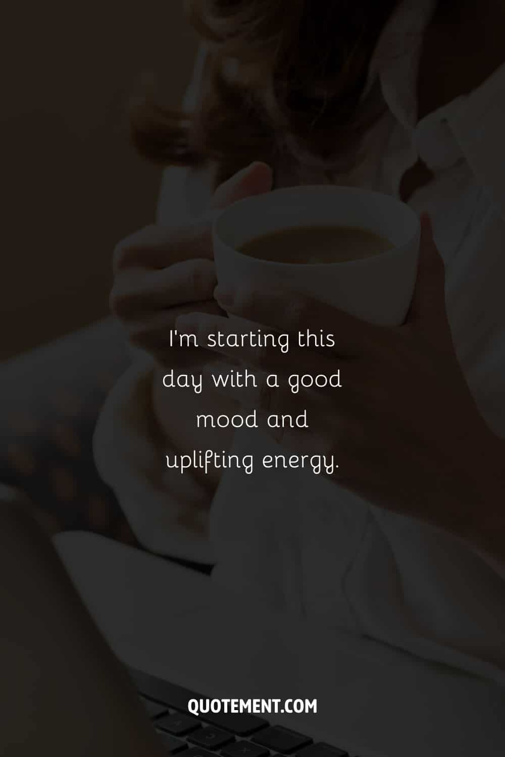 Image of a woman holding a cup of coffee representing a Tuesday morning affirmation.
