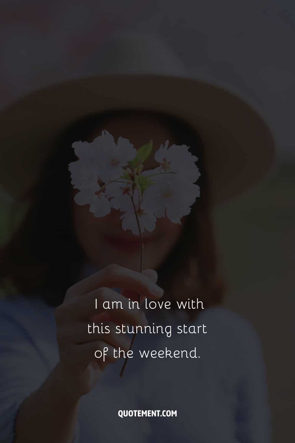 Image of a woman holding a flower representing weekend affirmation