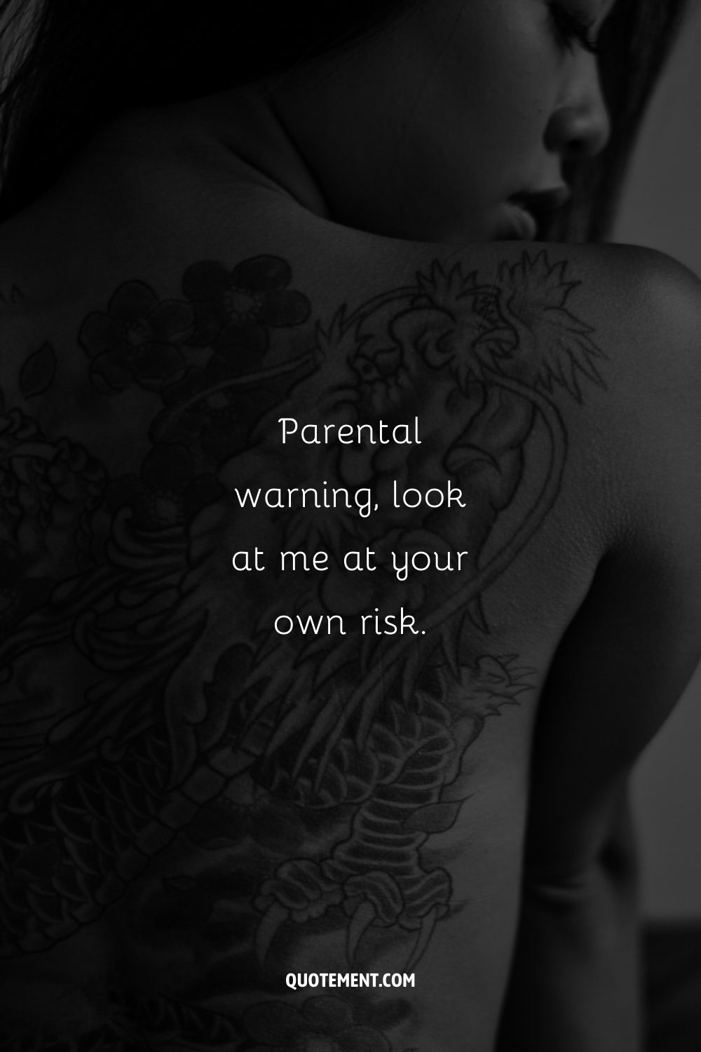 Image of a woman with a back tattoo representing a nude caption.