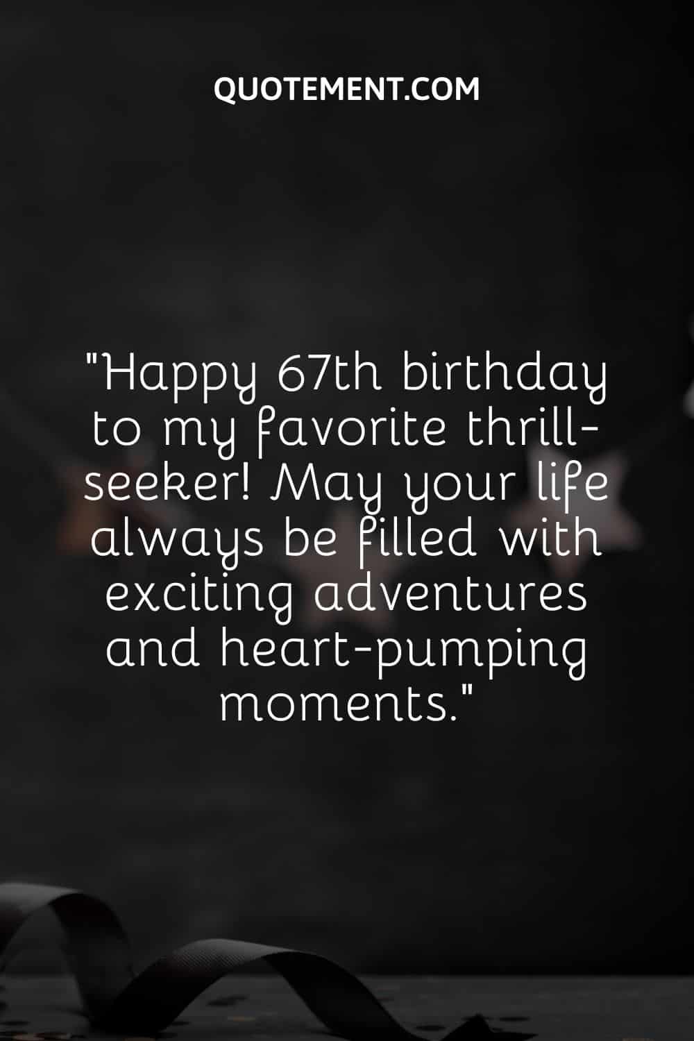 a curly black ribbon on a dark background representing a heartfelt way to wish a happy 67th birthday