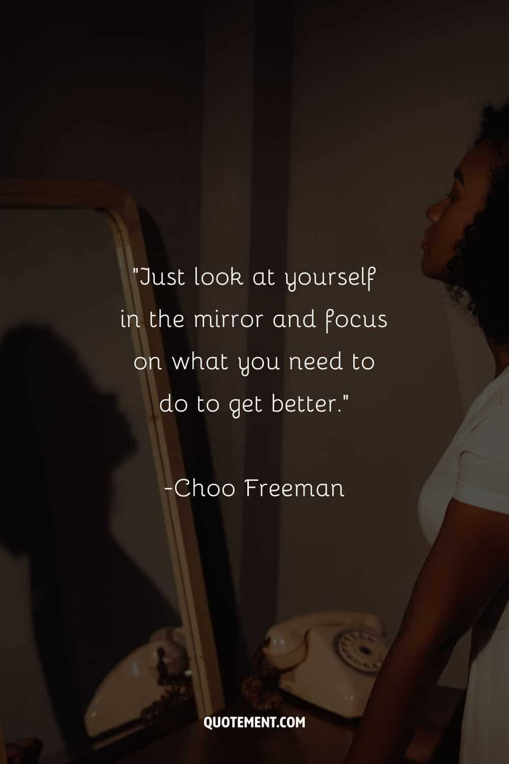 a girl looking at herself in the mirror representing an empowering quote about focusing on yourself
