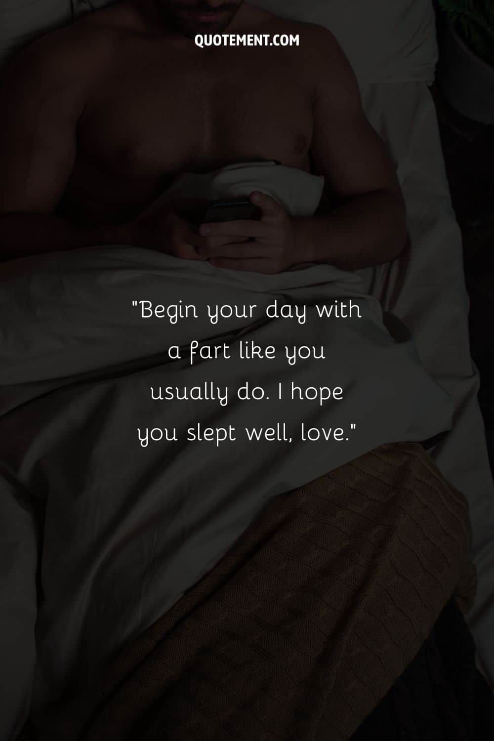 a guy in bed with his phone in his hands