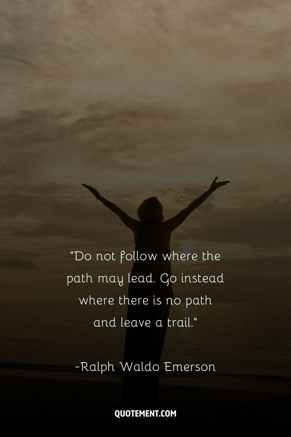 a woman standing at the beach and spreading her arms representing daily quote for inspiration
