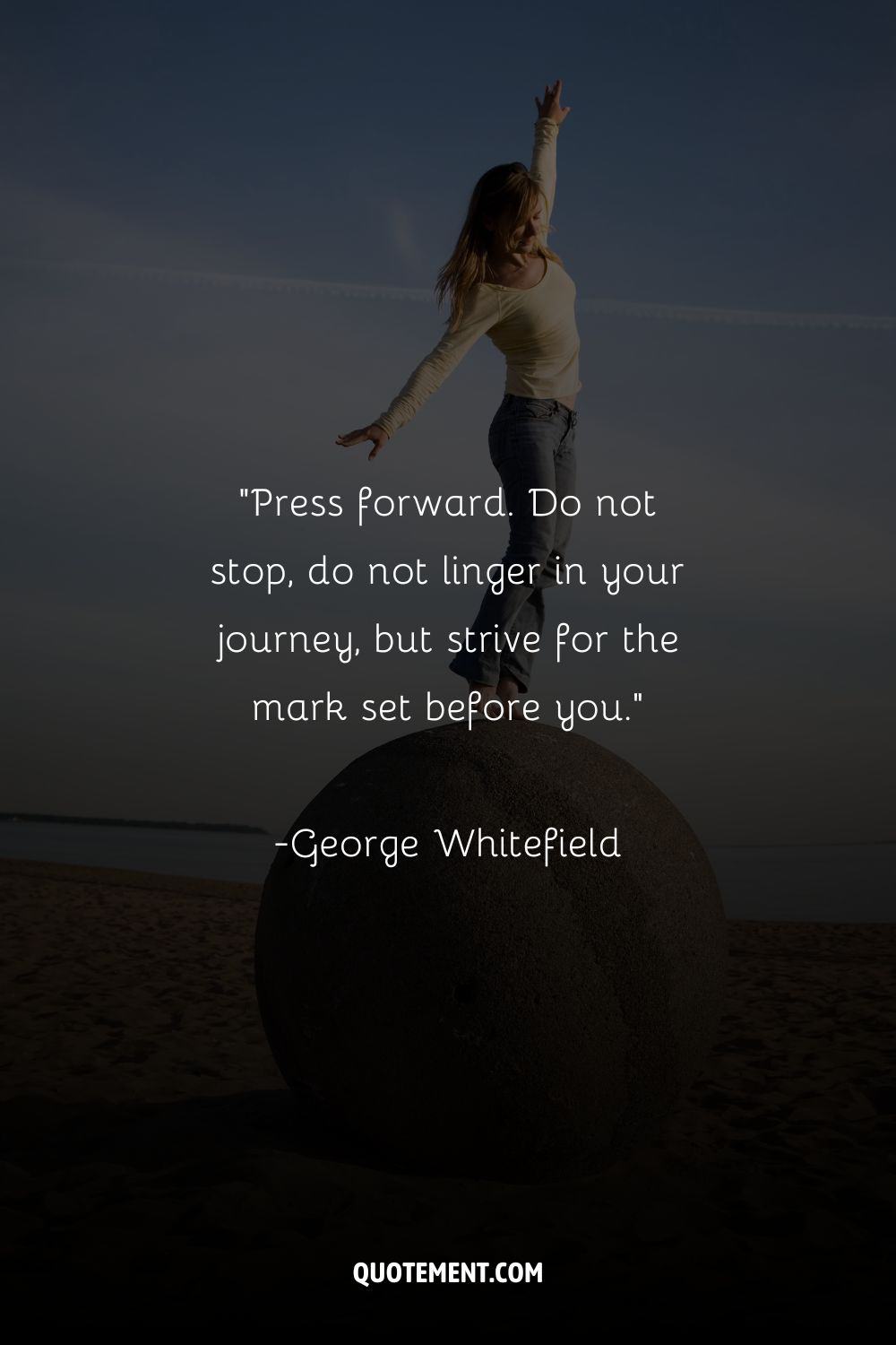 a woman standing on a huge round stone representing the best keep pushing quote