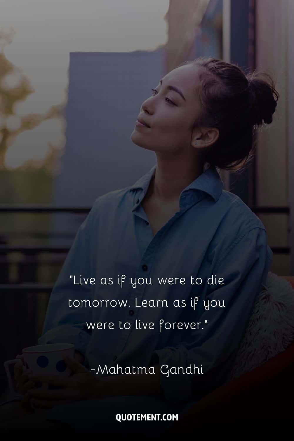 an Asian woman sitting and holding a mug representing the ultimate thought of the day quote
