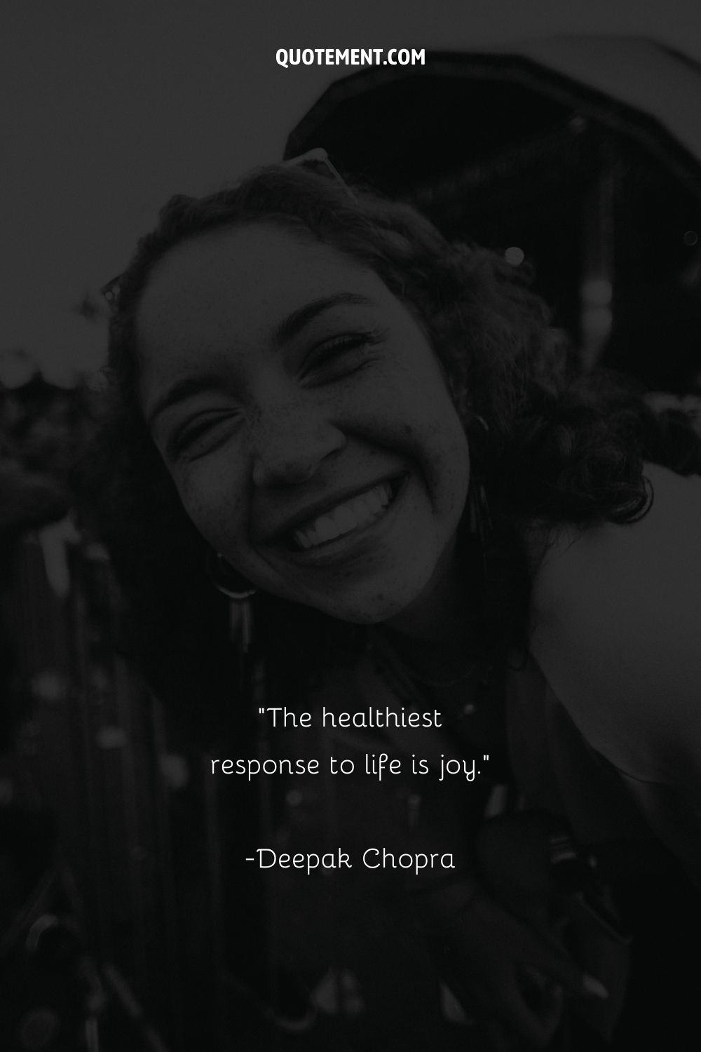 monochrome portrayal of a woman laughing representing a simple cute quote
