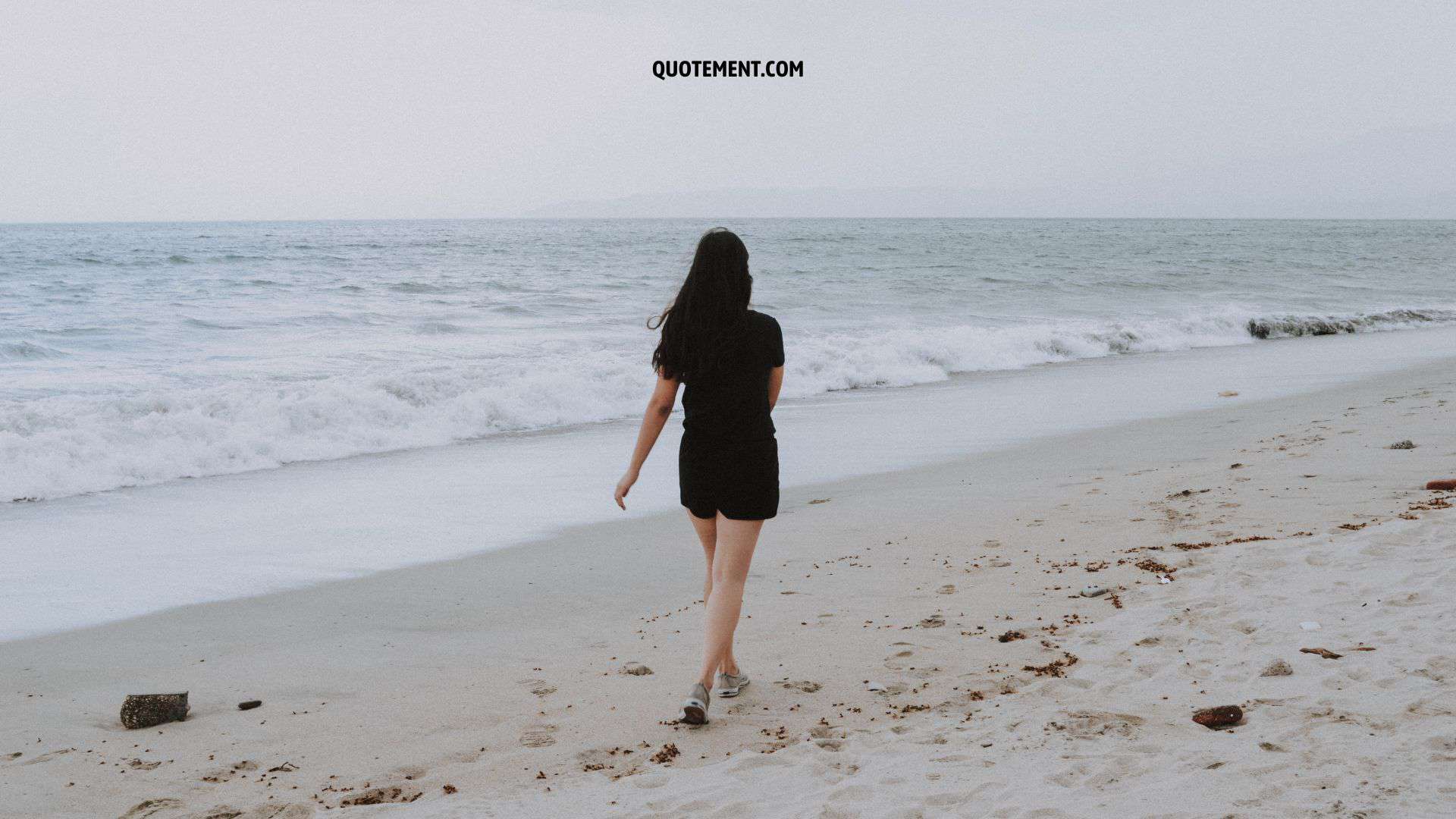 girl walking on shore