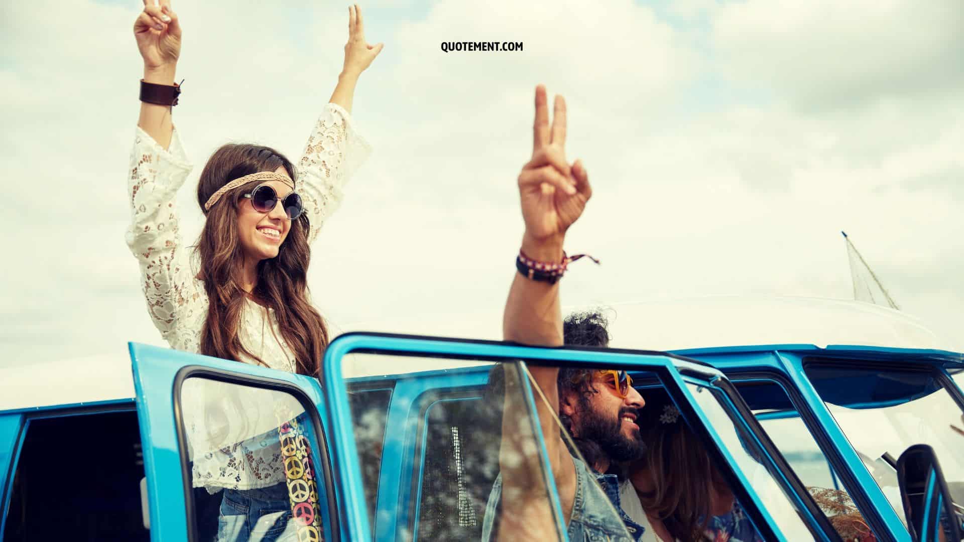 hippie couple holding up peace sign