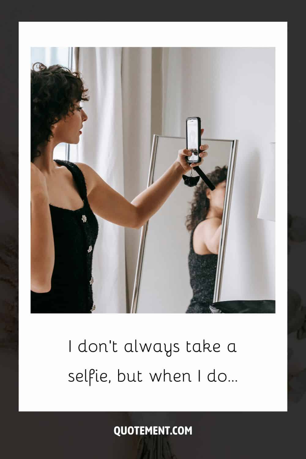 Image of a confident girl taking a selfie representing a selfie caption.
