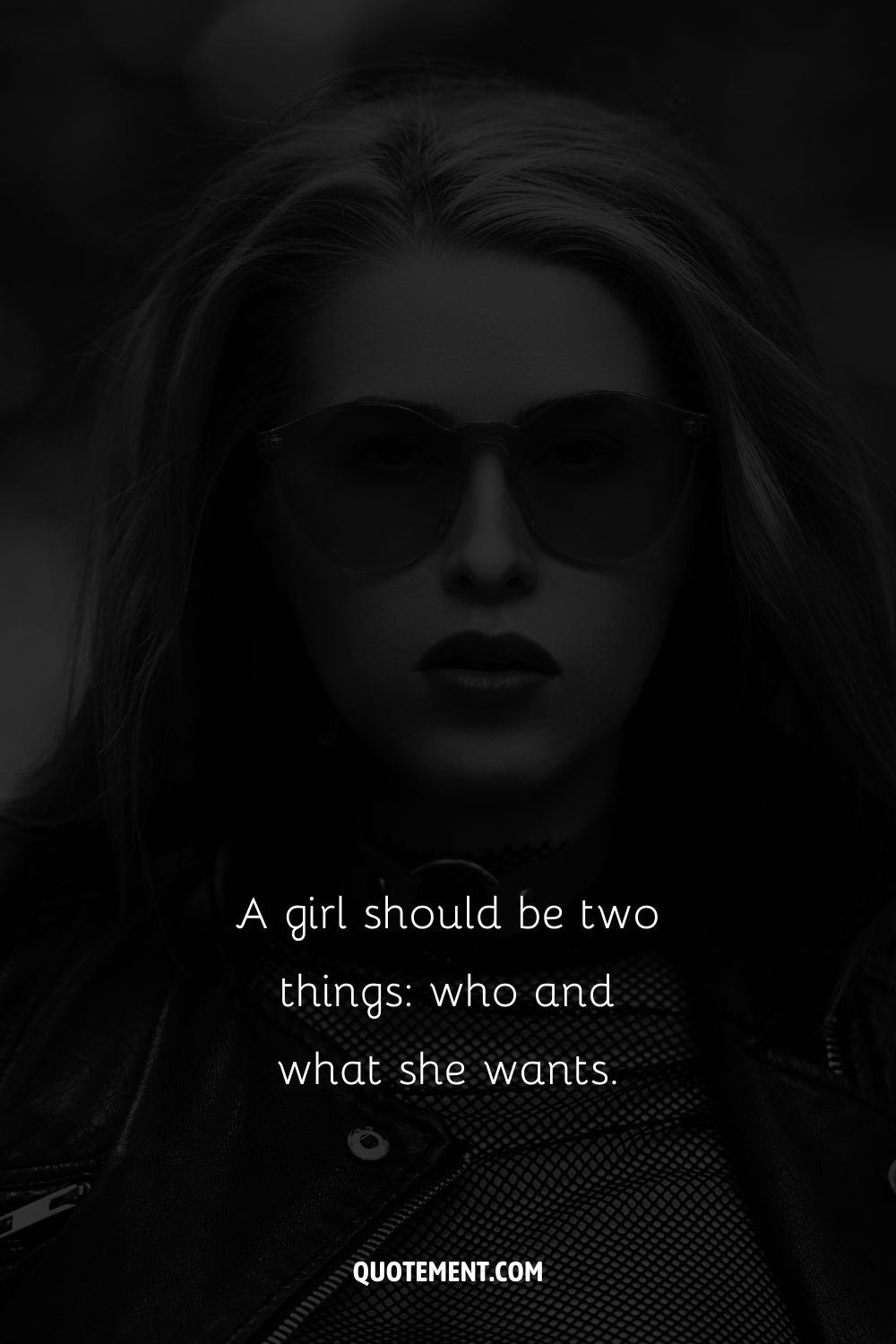 Image of a serious girl in sunglasses representing a bad bitch Instagram caption.