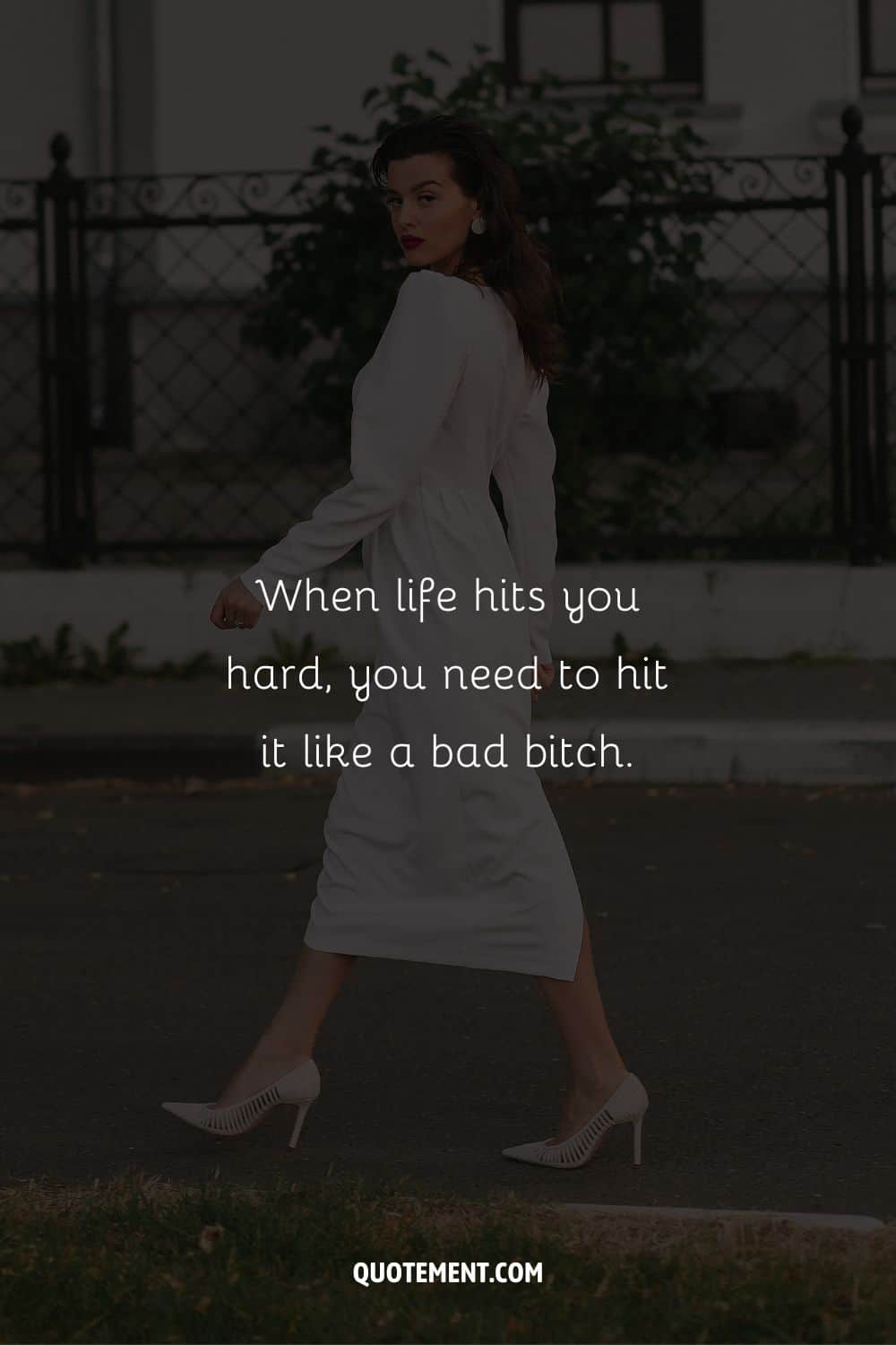 Image of a stunning lady wearing white representing boss bitch caption.