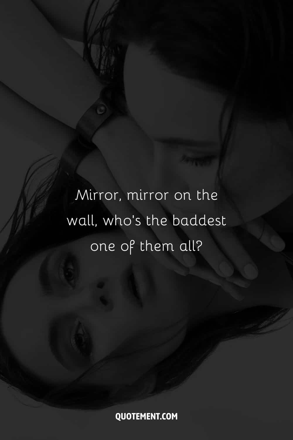 Image of a woman gazing at herself in mirror representing baddest bitch caption.