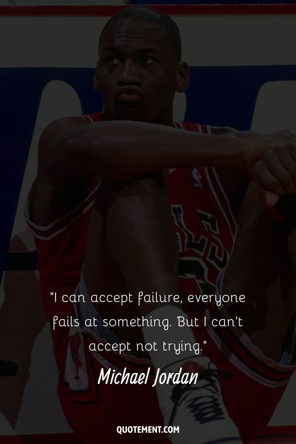 Michael Jordan sits with arms on his knees representing Michael Jordan failure quote