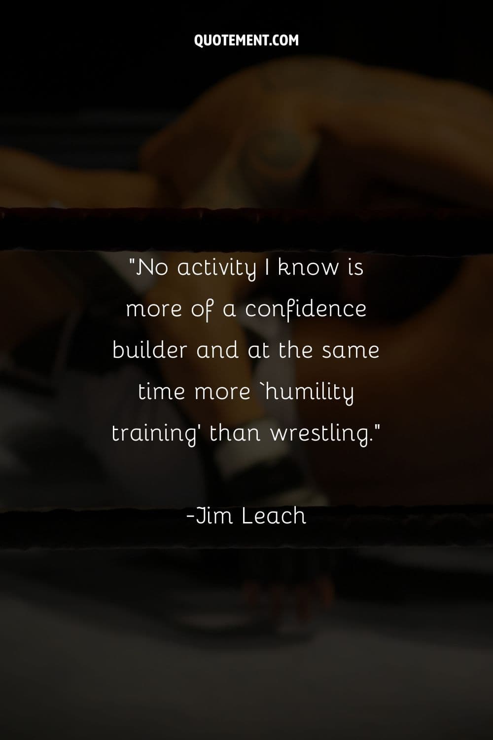 a blurry image of two wrestlers in the ring representing inspirational wrestling quote