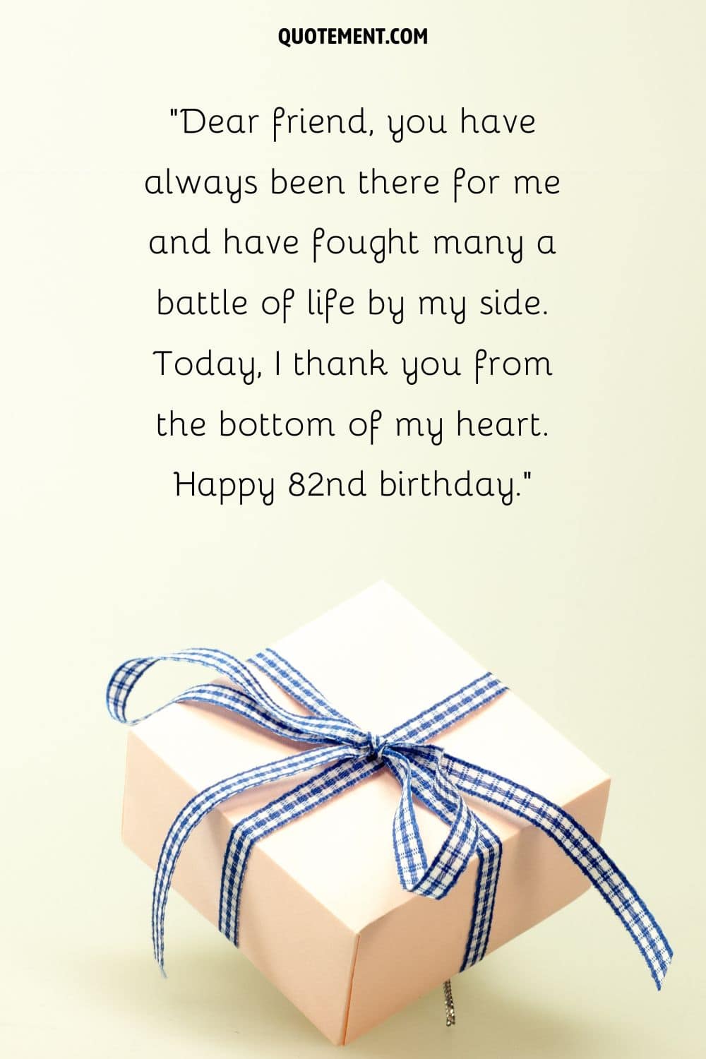 birthday gift wrapped in beige paper and blue ribbon