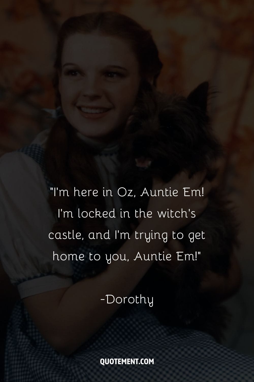 smiling Dorothy holds her beloved friend Toto
