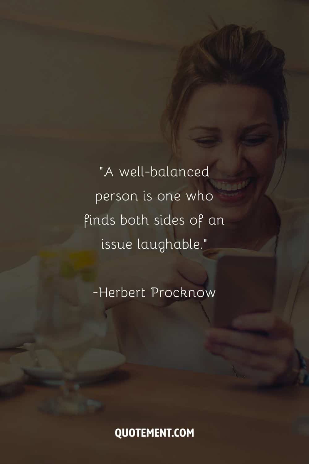 smiling blonde woman with a mug and phone representing an inspiring laughing quote