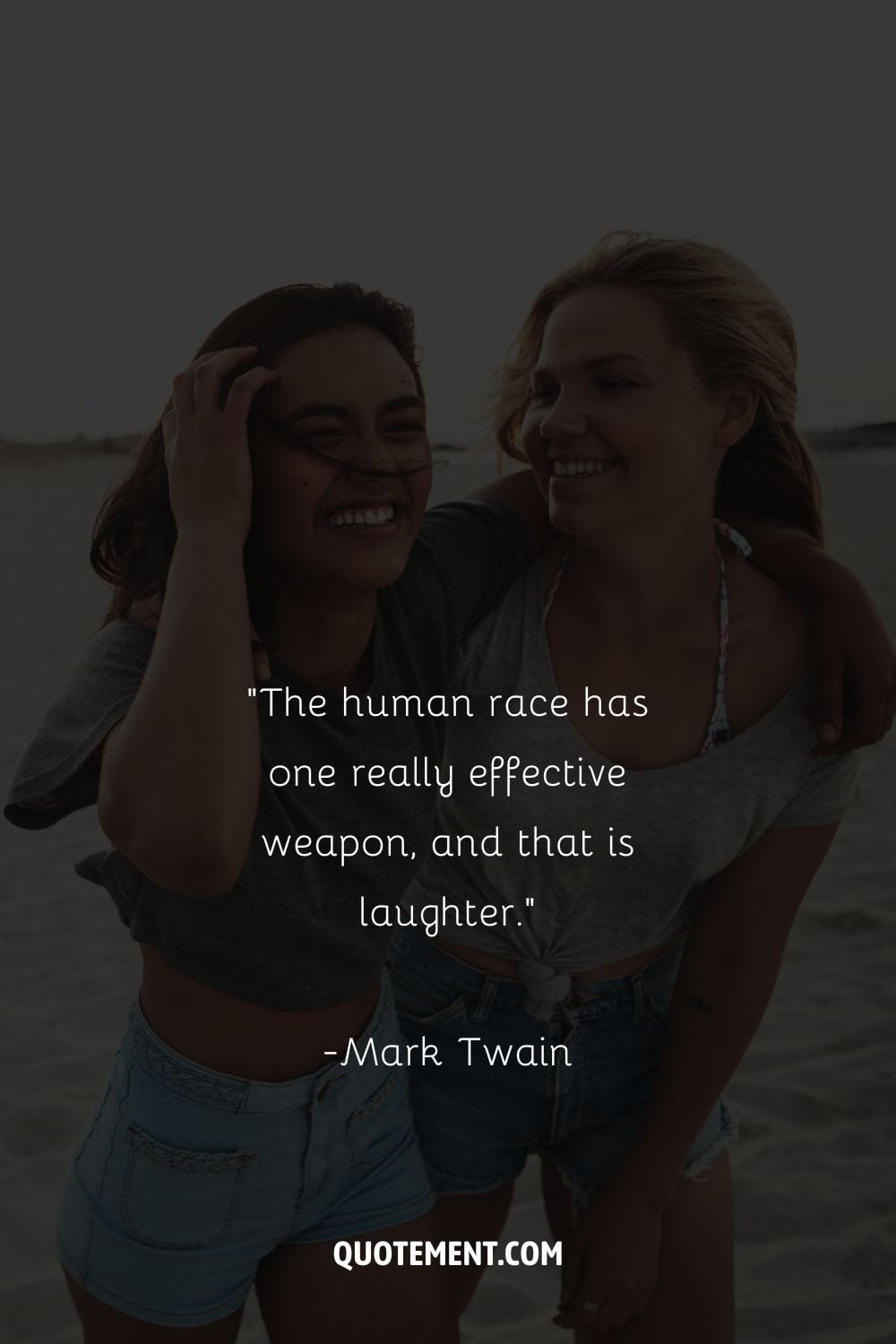 two smiling girls hugging on the shore representing the best quote about laughter