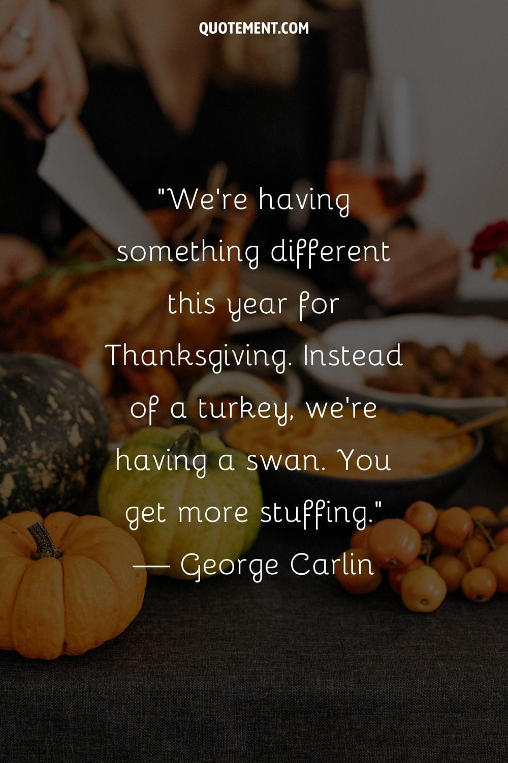 a hand carves the turkey on a table for Thanksgiving