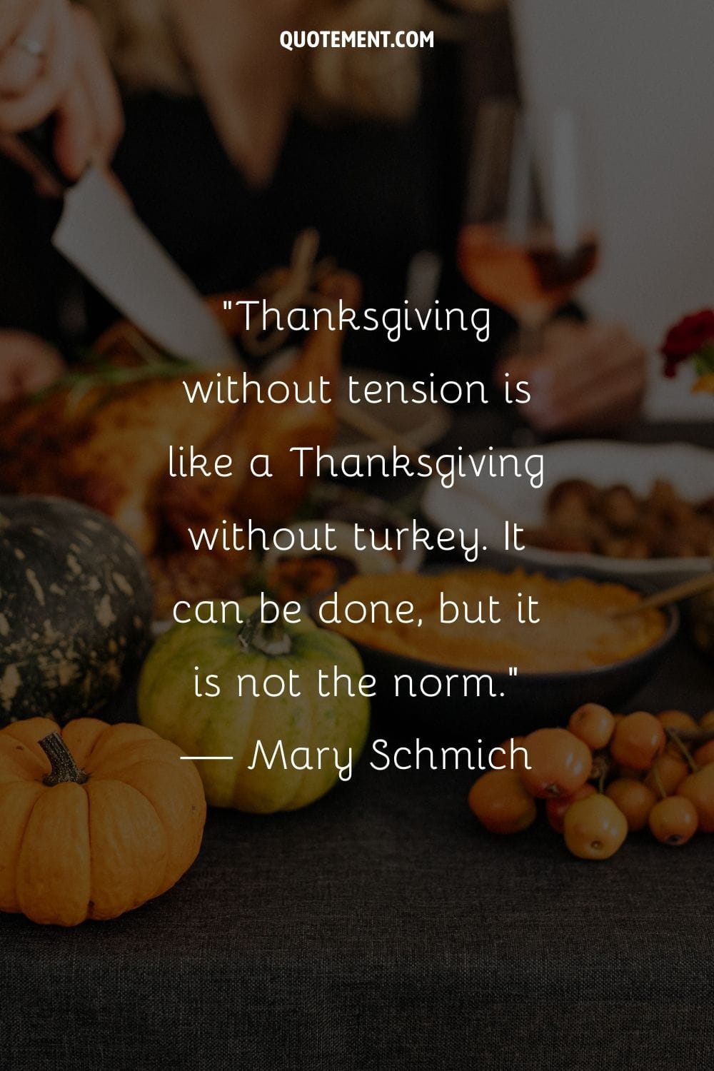 a hand carving the Thanksgiving turkey surrounded by festive decor